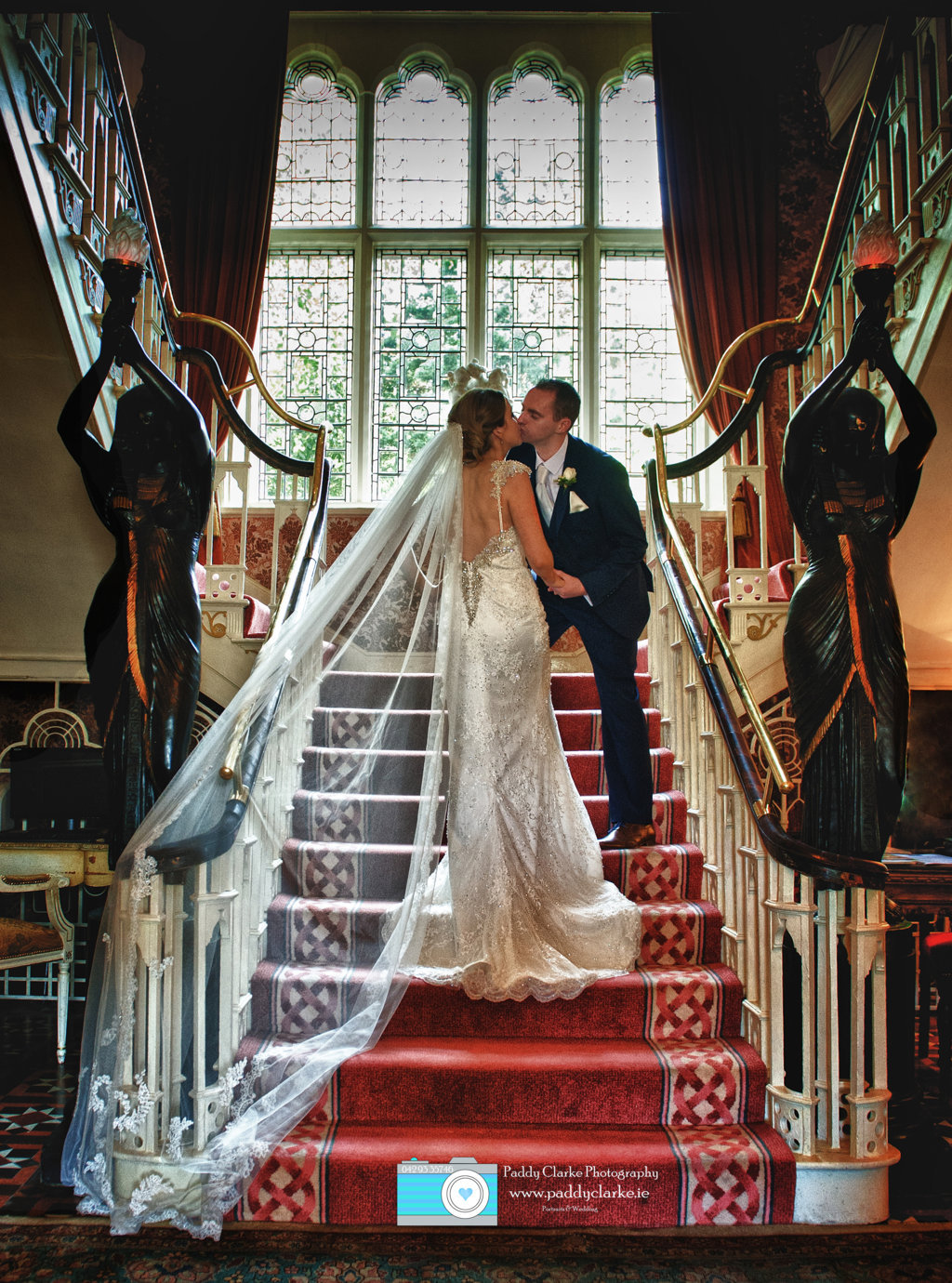 177 Bride and Groom on stairs in Cabra Castle.jpg